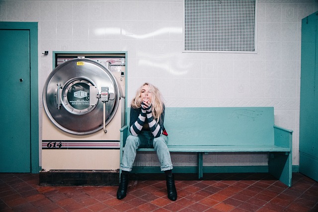 people, woman, sit, laundry, machine, shop, denim, blue, alone, blonde, laundry, laundry, laundry, laundry, laundry